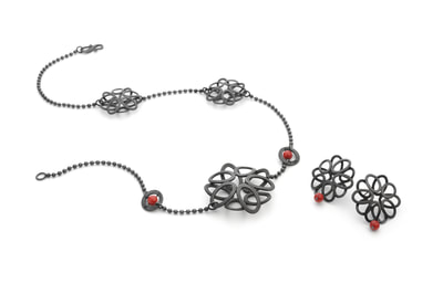 Assymetric oxidised necklace and earrings with bamboo coral.